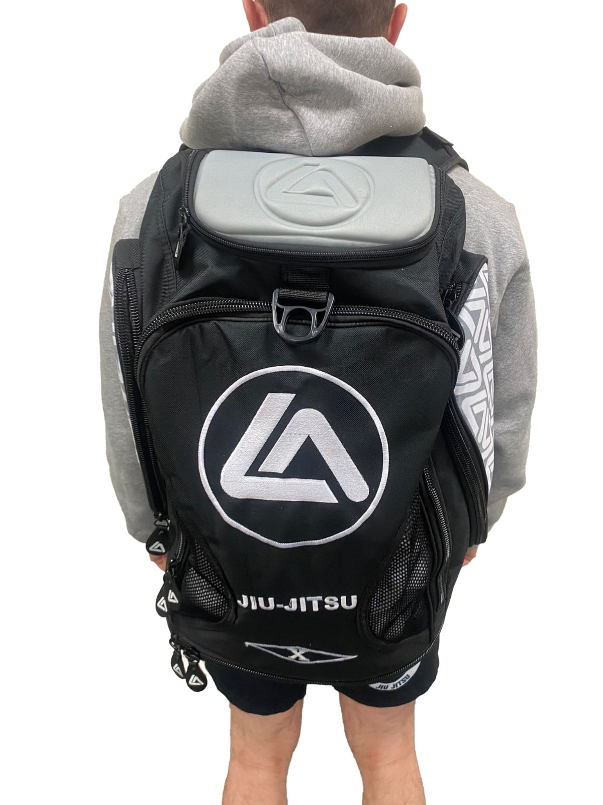the rear view of a roger gracie branded backpack
